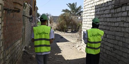 توزيع 435 كرتونة مواد غذائية للأولي بالرعاية بقري سمالوط